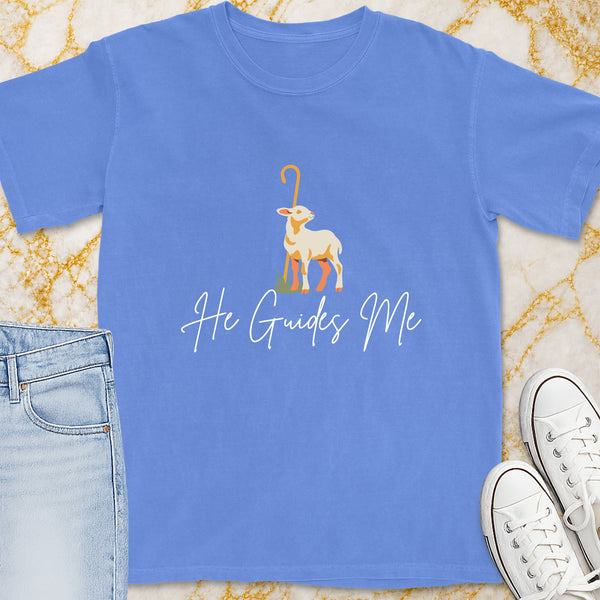Blue t-shirt with a graphic of a lamb and the text "He Guides Me".