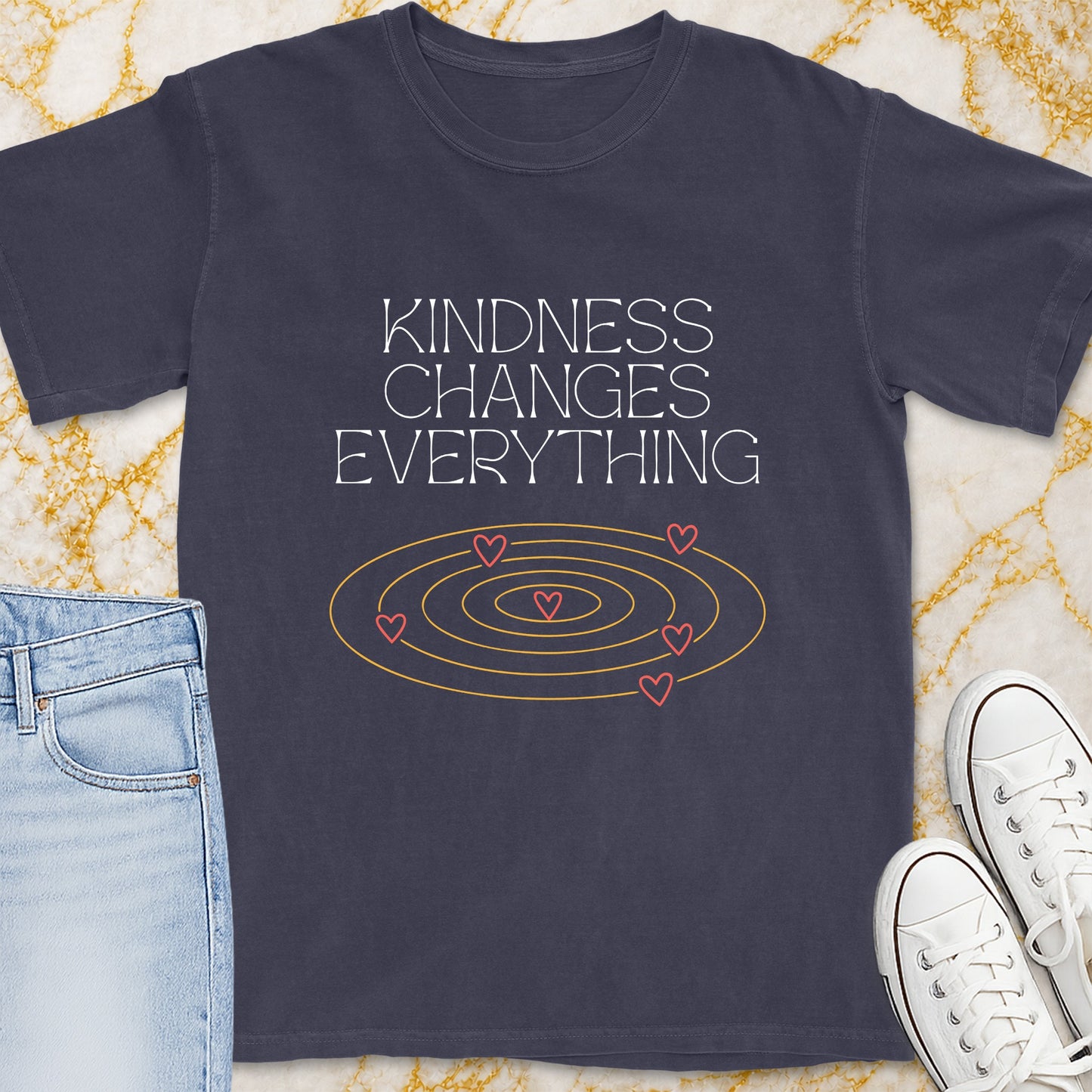 Dark gray t-shirt with "Kindness Changes Everything" text and heart spiral graphic.