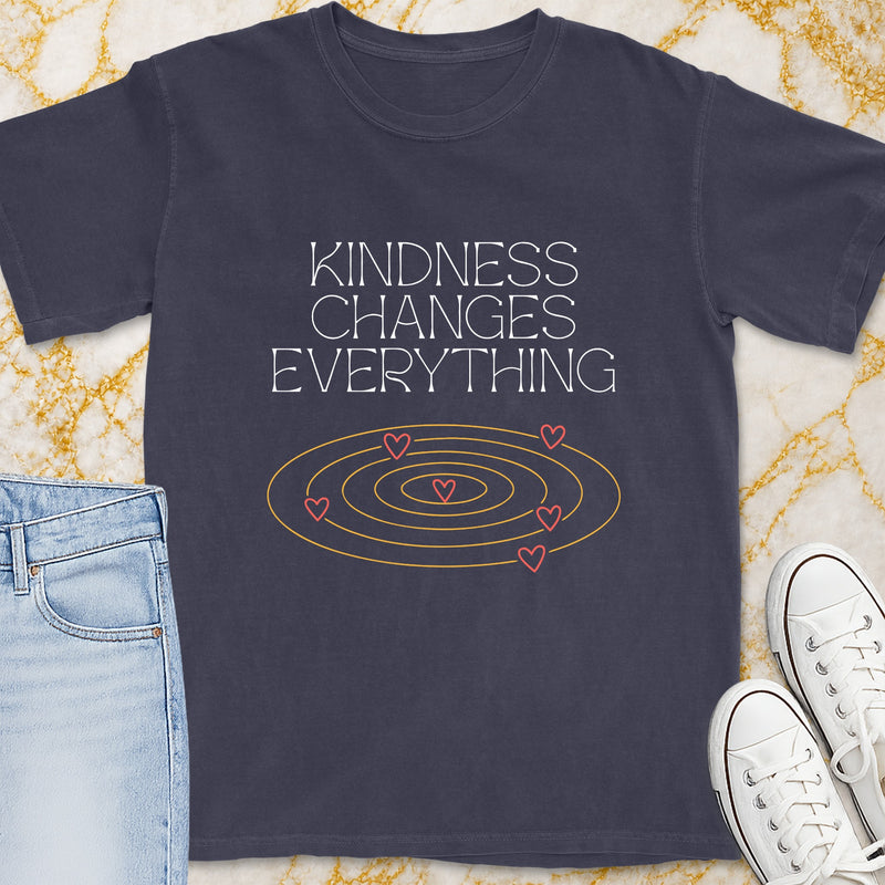 Dark gray t-shirt with "Kindness Changes Everything" text and heart spiral graphic.
