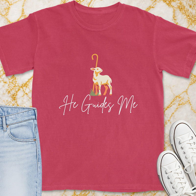 Pink t-shirt with a lamb and shepherd's crook graphic and text "He Guides Me".