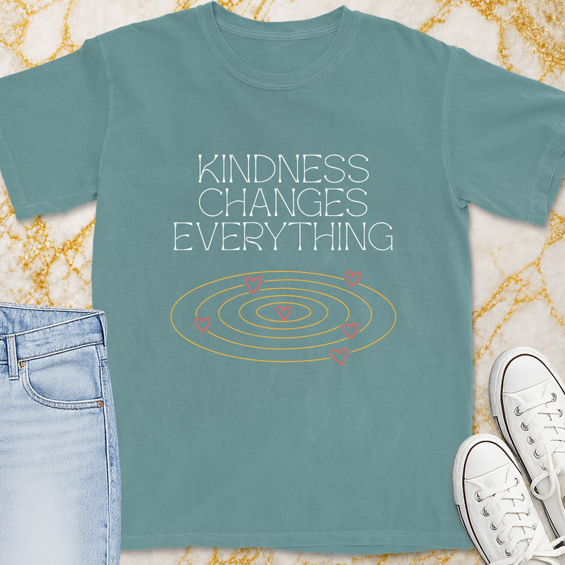 Teal t-shirt with "Kindness Changes Everything" and a heart concentric circle graphic.