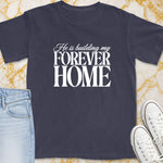 Dark t-shirt with white text "He is building my FOREVER HOME."